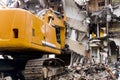 Bulldozer demolishes old buildings. demolition of a building in the harbor area