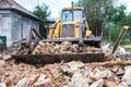 Bulldozer demolishing an old building Royalty Free Stock Photo