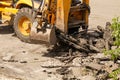 Bulldozer Dismantles Asphalt at Work