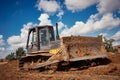 Bulldozer earthmover working with clay or soil