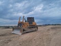 Bulldozer on earthwork landfilling industrial park