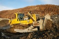 Bulldozer, earthworks in highlands, landscape, autumn.