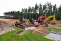 Bulldozer, Excavator and Soil compactor on road work. Earth-moving heavy equipment and Construction machinery  during land Royalty Free Stock Photo