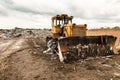 Bulldozer on garbage dump