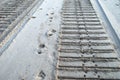 Bulldozer and human tracks in sand Royalty Free Stock Photo