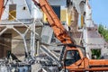 Excavator with hydraulic jaws work at demolition site Royalty Free Stock Photo