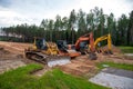 Bulldozer Komatsu, Vibro Roller Soil Compactor HAMM, Excavators Hitachi and Komatsu on road work. Construction site with heavy