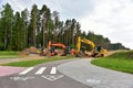 Bulldozer Komatsu, Vibro Roller Soil Compactor HAMM, Excavators Hitachi and Komatsu on road work. Construction site with heavy