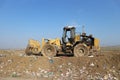 Bulldozer landfill compactor in a sanitary landfill