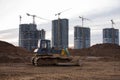 Bulldozer during of large construction jobs at building site. Crawler tractor dozer for earth-moving. Royalty Free Stock Photo