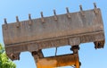 Bulldozer lifting bucket. Excavator bucket against sky Royalty Free Stock Photo