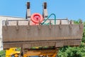 Bulldozer lifting bucket. Excavator bucket against sky Royalty Free Stock Photo