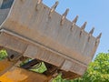 Bulldozer lifting bucket. Excavator bucket against sky Royalty Free Stock Photo