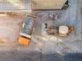 Bulldozer loader uploading waste and debris into dump truck at construction site. building dismantling and construction Royalty Free Stock Photo