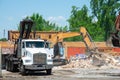 bulldozer loading demolition debris and concrete waste for recycling at construction site Royalty Free Stock Photo