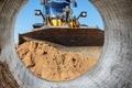 Bulldozer machine is leveling construction site. Earthmover with caterpillar is moving earth. Close-up. Construction heavy Royalty Free Stock Photo