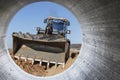 Bulldozer machine is leveling construction site. Earthmover with caterpillar is moving earth. Close-up. Construction heavy Royalty Free Stock Photo