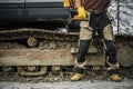 Bulldozer Operator in Front of His Crawler