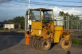 Bulldozer for paving yellow asphalt. Heavy machinery for road repair