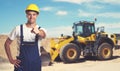 Bulldozer with pointing latin american construction worker Royalty Free Stock Photo