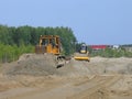 the bulldozer pushes the sand, and the skating rink rolls behind it