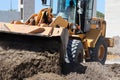 Bulldozer Pushing Dirt at Construction Site Royalty Free Stock Photo