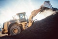 Bulldozer putting biomass on pile for composting Royalty Free Stock Photo