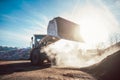 Bulldozer putting biomass on pile for composting