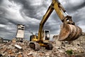 Bulldozer removes the debris from demolition of derelict buildings Royalty Free Stock Photo