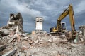 Bulldozer removes the debris from demolition of derelict buildings Royalty Free Stock Photo