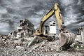 Bulldozer removes the debris from demolition of derelict buildings Royalty Free Stock Photo