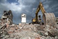 Bulldozer removes the debris from demolition of derelict buildings Royalty Free Stock Photo