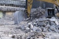 Bulldozer removes the debris from demolition of old derelict buildings construction scrap debris Royalty Free Stock Photo