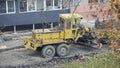 Bulldozer repairs the road in the yard