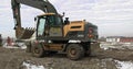 Bulldozer Rides on Sandy Road. Construction Machinery At Work On Building A House. Different Types Of Tractors And