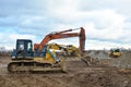 Bulldozer Shantui SD16 and Group Excavators brands of the Kraneks and CATERPILLAR with buckets