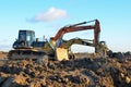 Bulldozer Shantui SD16 and Group Excavators brands of the Kraneks and CATERPILLAR with buckets