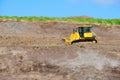 Bulldozer tractor working on steep hillside