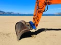 bulldozer cleaning the beach