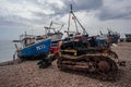 Bulldozers at Hastings fishing boats on the beach at Rock-a-Nore