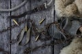 Bullet shells and rusy chain resting on wooden table