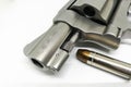 Bullet close-up on 38 Super ammo with a handgun on white background Royalty Free Stock Photo