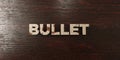 Bullet - grungy wooden headline on Maple - 3D rendered royalty free stock image
