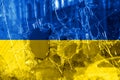 Bullet hole, cracks in the glass on a yellow-blue background. Ukraine flag on broken glass texture. Concept, Russian-Ukrainian war