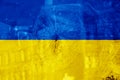 Bullet hole, cracks in the glass on a yellow-blue background. Ukraine flag on broken glass texture. Concept, Russian-Ukrainian war