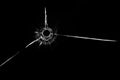 Bullet hole in glass close up on black background Royalty Free Stock Photo