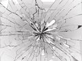 Bullet hole and pieces of shattered or smashed glass Royalty Free Stock Photo