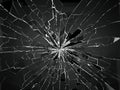 Bullet hole and pieces of shattered or smashed glass Royalty Free Stock Photo