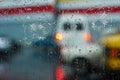 Bullet holes in glass against the background of a blurred city close up Royalty Free Stock Photo