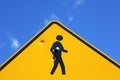Bullet holes in stick figure of yellow road sign Royalty Free Stock Photo